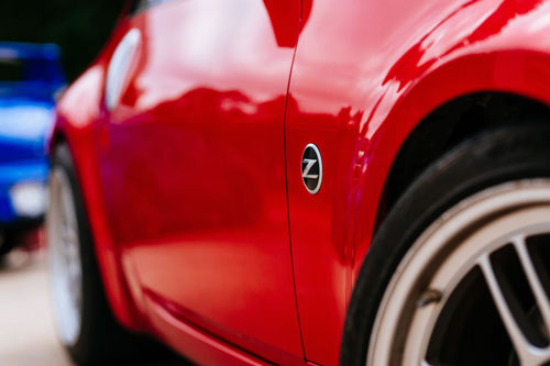 closeup of a red Nissan 350Z
