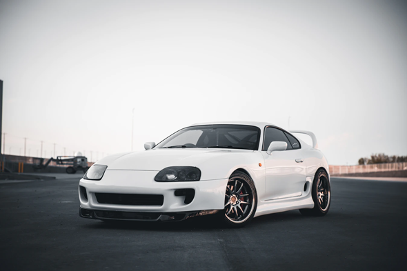 White Toyota Supra in empty parking lot